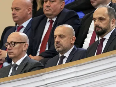 Politician and wealthy businessman Milan Radoicic, center, Serb List leader Goran Rakic, left, and former mayor of the Serb part of the ethnically divided town of Mitrovica Milan Radojevic attend a special session of Serbia's parliament about the negotiating process with Kosovo, in Belgrade, Serbia on Feb. 2, 2023. Serbian police on Tuesday detained an ethnic Serb leader Milan Radoicic from Kosovo who was the alleged organizer behind a recent shootout with Kosovo police that left four people dead and sent tensions soaring in the region. (AP Photo/Darko Vojinovic, File)