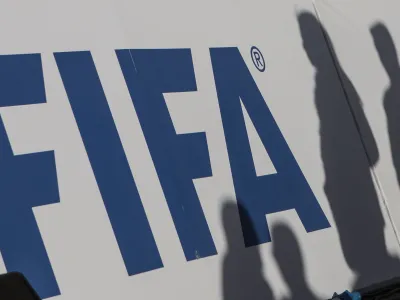 FILED - 06 January 2020, Egypt, Giza: The shadows of spectators can be seen on a FIFA banner. Photo: Omar Zoheiry/dpa