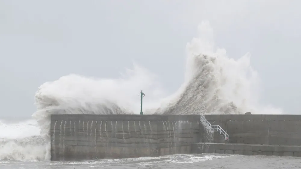 Waves break against the protecting walls of the Fugang Fishing Harbour as Typhoon Koinu moves past the southern tip of Taiwan, in Taitung, Taiwan October 5, 2023. REUTERS/Carlos Garcia Rawlins