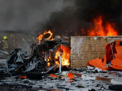 Objects burn on a road after rockets were launched from the Gaza Strip, in Ashkelon, Israel October 7, 2023. REUTERS/Amir Cohen