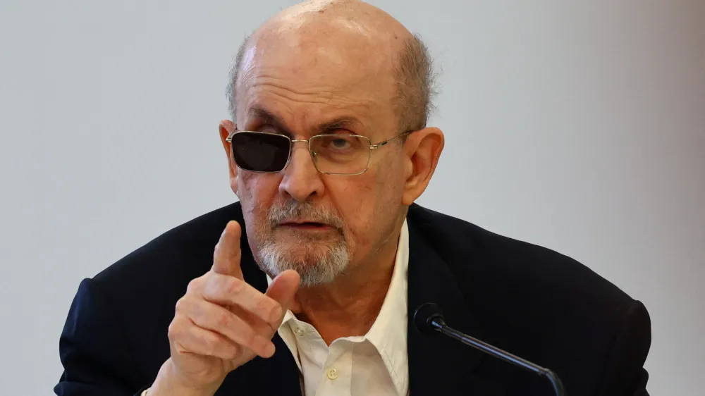 Author Salman Rushdie gestures during a news conference at the Book Fair in Frankfurt, Germany, October 20, 2023.   REUTERS/Kai Pfaffenbach