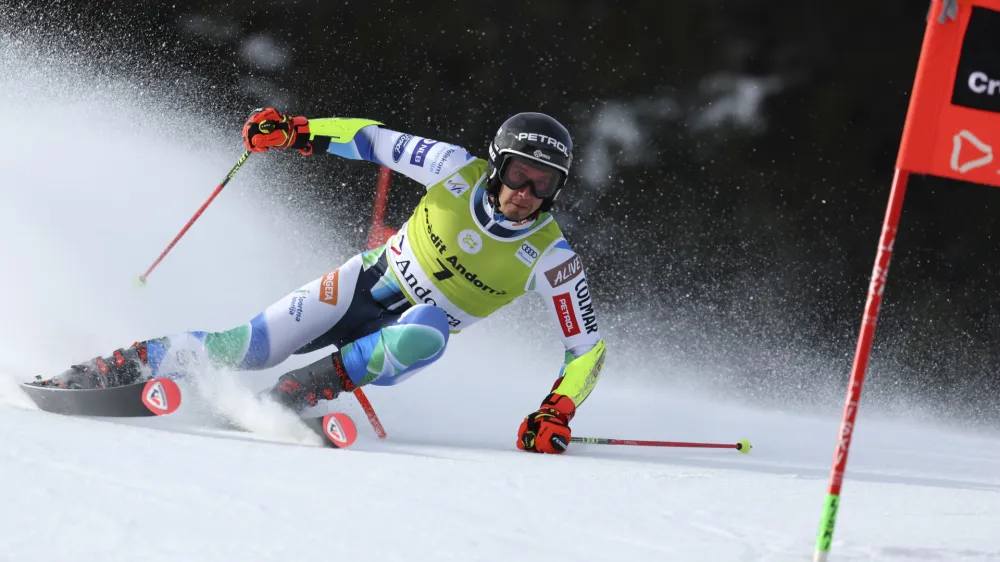 Slovenia's Zan Kranjec speeds down the course during a men's World Cup giant slalom race, in Soldeu, Andorra, Saturday, March 18, 2023. (AP Photo/Alessandro Trovati)