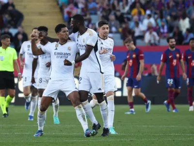 Soccer Football - LaLiga - FC Barcelona v Real Madrid - Estadi Olimpic Lluis Companys, Barcelona, Spain - October 28, 2023 Real Madrid's Jude Bellingham celebrates scoring their first goal with Antonio Rudiger REUTERS/Nacho Doce