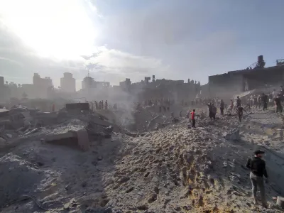 FILE - Palestinians inspect the damage of buildings destroyed by Israeli airstrikes on Jabaliya refugee camp on the outskirts of Gaza City on Oct. 31, 2023. In just 25 days of war, more than 3,600 Palestinian children have been killed in Gaza, according to Gaza's Hamas-run Health Ministry. The advocacy group Save The Children says more children were killed in Gaza in October 2023 than in all conflict zones around the world combined in 2022. (AP Photo/Abdul Qader Sabbah, File)