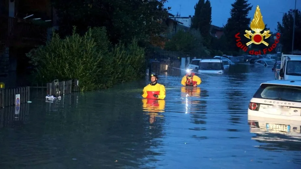 FILE PHOTO: Italian firefighters work in flooded streets in the Tuscany region, Italy, November 3, 2023. Several people died and went missing in the central region of Tuscany as Storm Ciaran battered western Europe. Vigili del Fuoco/Handout via REUTERS ATTENTION EDITORS THIS IMAGE HAS BEEN SUPPLIED BY A THIRD PARTY. DO NOT OBSCURE LOGO./File Photo