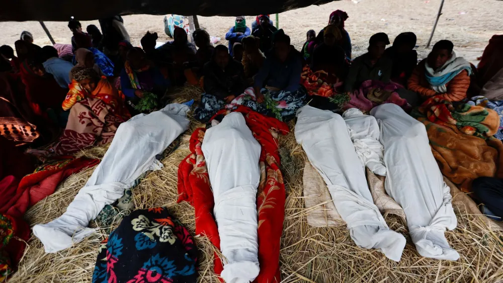  SENSITIVE MATERIAL. THIS IMAGE MAY OFFEND OR DISTURB  Family members sit next to the bodies of people who died during an earthquake in Jajarkot, Nepal November 5, 2023. REUTERS/Navesh Chitrakar