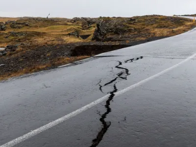 Cracks emerge on a road due to volcanic activity near a golf course, in Grindavik, Iceland November 11, 2023.  RUV/Ragnar Visage/Handout via REUTERS  THIS IMAGE HAS BEEN SUPPLIED BY A THIRD PARTY. NO RESALES. NO ARCHIVES. MANDATORY CREDIT