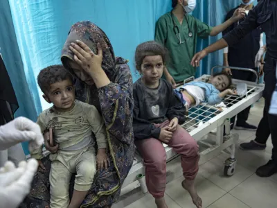 Palestinians wounded in Israeli bombardment of the Gaza Strip are brought to a hospital in Khan Younis, Sunday, Nov. 12, 2023. (AP Photo/Fatima Shbair)