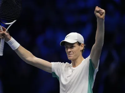 Italy's Jannik Sinner celebrates after winning the singles tennis match against Serbia's Novak Djokovic, of the ATP World Tour Finals at the Pala Alpitour, in Turin, Italy, Tuesday, Nov. 14, 2023. (AP Photo/Antonio Calanni)