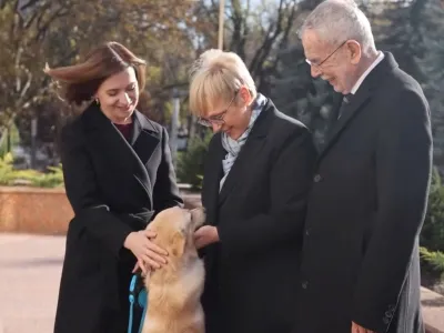 Moldova's President Maia Sandu and her dog greet Austria's President Alexander Van der Bellen and Slovenia's President Natasa Pirc Musar in Chisinau, Moldova November 16, 2023, in this handout picture. Maia Sandu via Facebook/Handout via REUTERS THIS IMAGE HAS BEEN SUPPLIED BY A THIRD PARTY. MANDATORY CREDIT. NO RESALES. NO ARCHIVES.