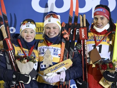 From left, second placed Jonna Sundling, of Sweden, winner Emma Ribom of Sweden and third placed Kristine Stav's Skistad of Norway celebrate after the women's cross-country skiing classic style sprint finals at the FIS World Cup Ruka Nordic Opening event in Kuusamo, Finland, Friday, Nov. 24, 2023. (Heikki Saukkomaa/Lehtikuva via AP)