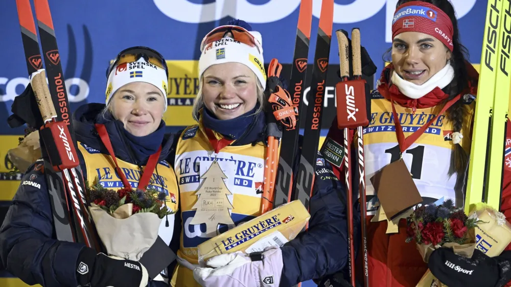 From left, second placed Jonna Sundling, of Sweden, winner Emma Ribom of Sweden and third placed Kristine Stav's Skistad of Norway celebrate after the women's cross-country skiing classic style sprint finals at the FIS World Cup Ruka Nordic Opening event in Kuusamo, Finland, Friday, Nov. 24, 2023. (Heikki Saukkomaa/Lehtikuva via AP)