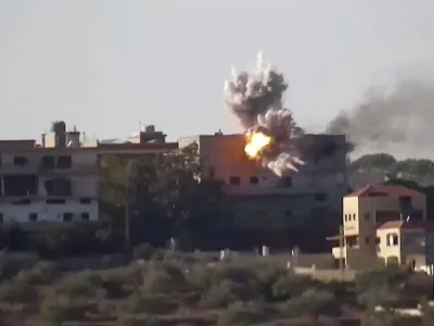 Smoke and fire rise from a building following an Israeli strike on what the Israeli military says are Hezbollah targets in a location given as Lebanon, amid the ongoing cross-border hostilities between Hezbollah and Israeli forces, in this screengrab taken from an undated handout video released on November 24, 2023. Israel Defense Forces/Handout via REUTERS THIS IMAGE HAS BEEN SUPPLIED BY A THIRD PARTY