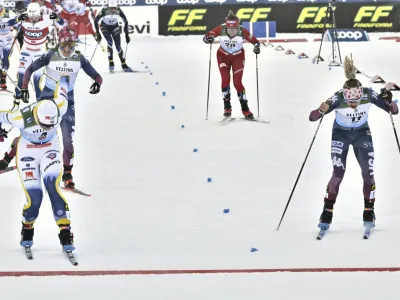 Sweden's Moa Ilar, left, crossed the finish line ahead of United State's Jessie Diggins, to win the women's 20 km mass start freestyle competition, at the cross-country ski World Cup Ruka Nordic Opening event in Kuusamo, Finland, on Sunday, Nov. 26, 2023. (Heikki Saukkomaa/Lehtikuva via AP)