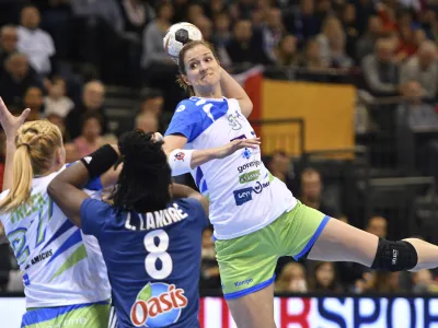 ﻿Slovenia's Ana Gros throws for goal against France's Laurisa Landre during the women's handball world championships match between France and Slovenia at Arena Trier in Trier, Germany, Saturday Dec. 2, 2017. (Harald Tittel/dpa via AP)