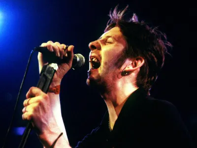 FILE PHOTO: Shane MacGowan, former lead singer of The Pogues, performs during the Montreux Jazz festival in the [Miles Davis] Hall late July 15, 1995. MacGowan and his band The Popes were part of the 'Irish Night' during the festival. REUTERS/Stringer/File Photo