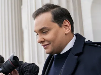 Rep. George Santos, R-N.Y., leaves the Capitol after being expelled from the House of Representatives, Friday, Dec. 1, 2023, in Washington. The House has voted to expel Santos following a critical ethics report on his conduct that included converting campaign donations for his own use, making him just the sixth member in the chamber's history to be ousted by his colleagues. Expulsion requires support from two-third of the House. (AP Photo/Stephanie Scarbrough)