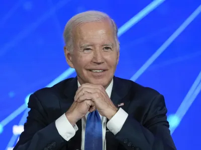 President Joe Biden smiles as members of the media leave the room and ask questions about his son Hunter Biden, during a discussion on managing the risks of Artificial Intelligence during an event in San Francisco, Tuesday, June 20, 2023. (AP Photo/Susan Walsh)