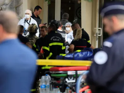 French police and rescue workers work at the site after a teacher was killed and several people injured in a knife attack at the Lycee Gambetta-Carnot high school in Arras, northern France, October 13, 2023. REUTERS/Pascal Rossignol