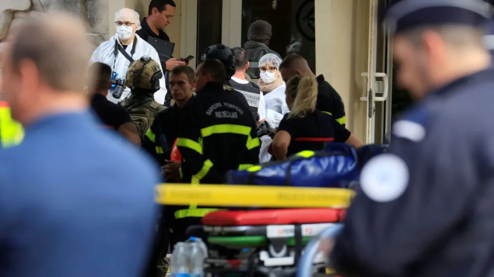 French police and rescue workers work at the site after a teacher was killed and several people injured in a knife attack at the Lycee Gambetta-Carnot high school in Arras, northern France, October 13, 2023. REUTERS/Pascal Rossignol