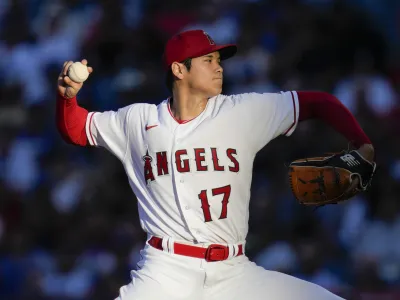 FILE - Los Angeles Angels starting pitcher Shohei Ohtani throws during a baseball game against the Los Angeles Dodgers in Anaheim, Calif., June 21, 2023. Ohtani agreed Saturday, Dec. 9, to a record 0 million, 10-year contract with the Dodgers. (AP Photo/Ashley Landis, File)