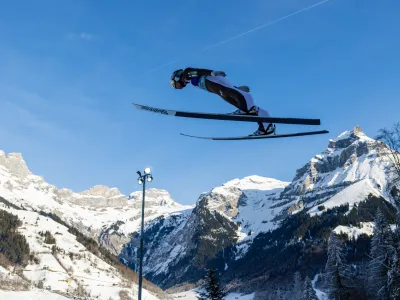 Anze Lanisek of Slovenia soars through the air during the men's FIS Ski Jumping World Cup competition at the Gross-Titlis Schanze on Sunday, Dec. 18, 2022 in Engelberg, Switzerland. (KEYSTONE/Philipp Schmidli)