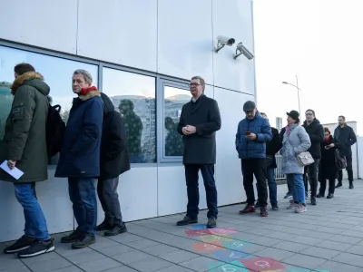 Serbian President Aleksandar Vucic waits in a queue to cast his vote at a polling station during the parliamentary election in Belgrade, Serbia, December 17, 2023. REUTERS/Zorana Jevtic REFILE - QUALITY REPEAT