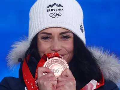 ﻿2022 Beijing Olympics - Victory Ceremony - Snowboard - Women's Parallel Giant Slalom - Zhangjiakou Medals Plaza, Zhangjiakou, China - February 8, 2022. Bronze medallist Gloria Kotnik of Slovenia poses with her medal during the victory ceremony. REUTERS/Kai Pfaffenbach