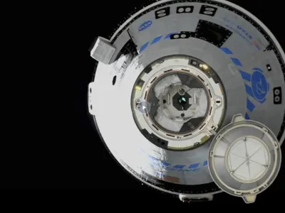 This image from NASA TV shows the Boeing Starliner approaching the International Space Station, Friday, May 20, 2022. Boeing's astronaut capsule has arrived at the International Space Station in a critical repeat test flight. Only a test dummy was aboard the capsule for Friday's docking, a huge achievement for Boeing after years of false starts. (NASA via AP)