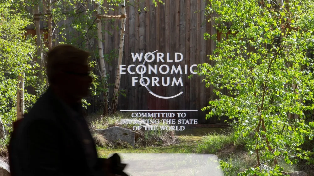 The logo of the upcoming World Economic Forum 2022 (WEF) is pictured on a window at the congress center, in the Alpine resort of Davos, Switzerland May 21, 2022. REUTERS/Arnd Wiegmann