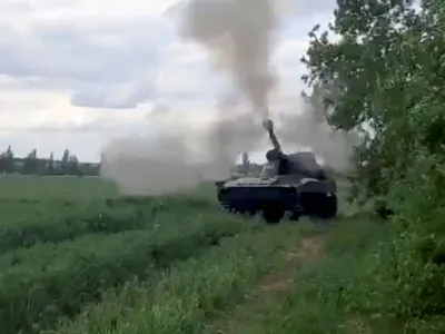 A howitzer is fired in location given as Donbas region, Ukraine in this still image taken from a video obtained by Reuters May 23, 2022. THIS IMAGE HAS BEEN SUPPLIED BY A THIRD PARTY.