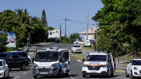 Municipal police vans patrol the streets in Noumea, New Caledonia, Thursday May, 16, 2024. France has imposed a state of emergency in the French Pacific territory of New Caledonia. The measures imposed on Wednesday for at least 12 days boost security forces' powers to quell deadly unrest that has left four people dead, erupting after protests over voting reforms. (AP Photo/Cedric Jacquot)