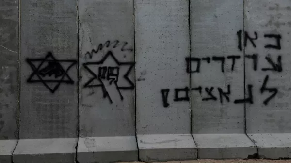 A blast wall sits marked with graffiti at the Kerem Shalom border crossing, as military operations continue in the southern Gaza city of Rafah, at an area outside Kerem Shalom, Israel, May 17, 2024. REUTERS/Shannon Stapleton