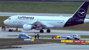 18 May 2024, Bavaria, Munich: Two activists have glued themselves to an access road for runways at Franz-Josef-Strauß Airport. The activists had reached the inner area of the airport grounds. According to their own statements, members of the 'Last Generation' activism group had planned to enter the airport grounds in order to block at least one of the two runways. Photo: Karl-Josef Hildenbrand/dpa