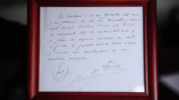 FILE - A framed copy of the napkin linking the 13-year-old Lionel Messi to FC Barcelona is seen in Barcelona, Spain on Jan. 5, 2012. British auction house Bonhams says the famous napkin that linked a young Lionel Messi to Barcelona has sold for $965,000. An agreement in principle to sign then 13-year-old Messi was written on the napkin almost 25 years ago at a Barcelona tennis club. (AP Photo/Manu Fernandez, File)