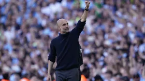 Manchester City's head coach Pep Guardiola celebrates at the end of the English Premier League soccer match between Manchester City and West Ham United at the Etihad Stadium in Manchester, England, Sunday, May 19, 2024. Manchester City clinched the English Premier League on Sunday after beating West Ham in their last match of the season. (AP Photo/Dave Thompson)