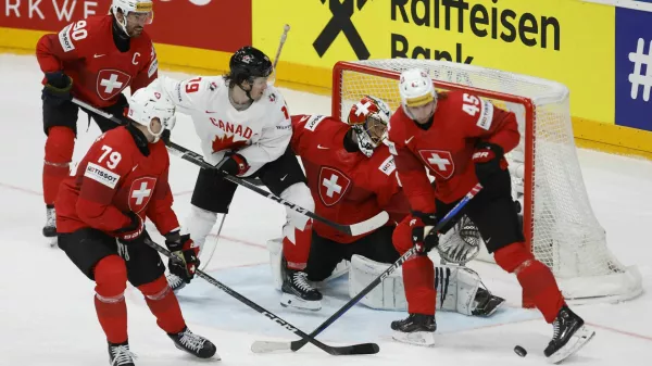 Ice Hockey - IIHF World Championships - Group A - Switzerland v Canada - Prague Arena, Prague, Czech Republic - May 19, 2024 Canada's Jared McCann in action with Switzerland's Leonardo Genoni and Michael Fora REUTERS/Eva Korinkova