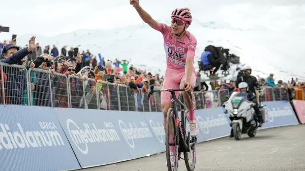 19 May 2024, Italy, Manerba del Garda: Slovenian cyclist Tadej Pogacar of Team UAE Emirates celebrates as he crosses the finish line to win the 15th stage of the 107th Giro d'Italia cycling race, 222km between Manerba del Garda and Mottolino. Photo: Marco Alpozzi/LaPresse via ZUMA Press/dpa