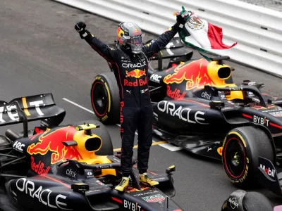 Formula One F1 - Monaco Grand Prix - Circuit de Monaco, Monte Carlo, Monaco - May 29, 2022 Red Bull's Sergio Perez celebrates after winning the race REUTERS/Benoit Tessier   TPX IMAGES OF THE DAY