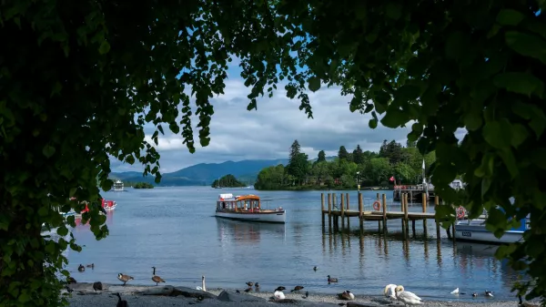 A pleasure boat leaves from a jetty on the banks of Lake Windermere, the largest lake in England, after a British government minister described it's water quality as "totally unacceptable" following an illegal release of sewage into the lake earlier in the year, in Bowness-on-Windermere, Britain, May 20, 2024. REUTERS/Phil Noble