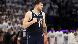 May 22, 2024; Minneapolis, Minnesota, USA; Dallas Mavericks guard Luka Doncic (77) reacts in the fourth quarter against the Minnesota Timberwolves during game one of the western conference finals for the 2024 NBA playoffs at Target Center. Mandatory Credit: Jesse Johnson-USA TODAY Sports