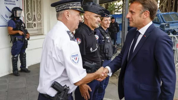 French President Emmanuel Macron visits the central police station in Noumea, New Caledonia, Thursday, May 23, 2024. Macron has met with local officials in riot-hit New Caledonia, after crossing the globe in a high-profile show of support for the French Pacific archipelago gripped by deadly unrest.(Ludovic Marin/Pool Photo via AP)