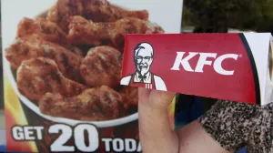 ﻿A customer holds a box of Kentucky Fried Chicken outside an KFC restaurant, Tuesday, July 13, 2010, in Mountain View, Calif. (AP Photo/Paul Sakuma)