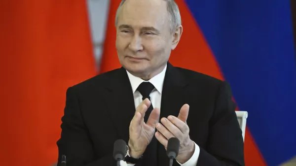 Russian President Vladimir Putin applauds as he attends a signing ceremony following his talks with Bahrain's Crown Prince and Prime Minister Salman bin Hamad bin Isa Al Khalifa at the Kremlin in Moscow, Russia, Thursday May 23, 2024. (Sergei Guneyev, Sputnik, Kremlin Pool Photo via AP)