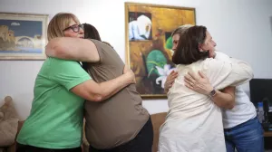 Members of the association Mothers of Srebrenica react after the United Nations General Assembly adopted a resolution declaring July 11 the International Day of Reflection and Commemoration of the 1995 genocide in Srebrenica, in Potocari, Bosnia, Thursday, May 23, 2024. (AP Photo/Armin Durgut)