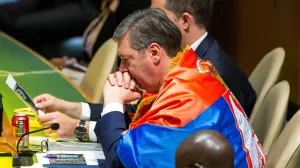 Serbian President Aleksandar Vucic wears a Serbian flag as he listens to delegates after the United Nations General Assembly's vote on the creation of an international day to commemorate the Srebrenica genocide, at the United Nations Headquarters in New York City, U.S. May 23, 2024. REUTERS/Eduardo Munoz