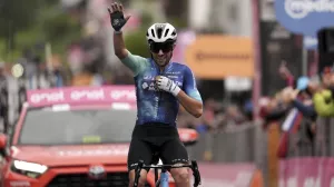 Italy's Andrea Vendrame celebrates winning the 19th stage of the Giro d'Italia cycling race from Mortegliano to Sappada, Italy, Friday, May 24, 2024. (Massimo Paolone/LaPresse via AP)