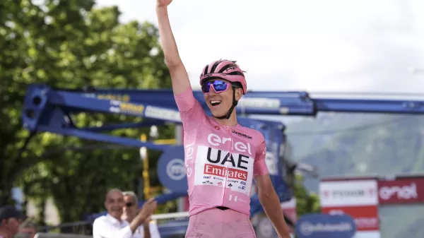 Slovenia's Tadej Pogacar, wearing the pink jersey of the race overall leader, celebrates winning the 20th stage of the Giro d'Italia cycling race from Alpago to Bassano del Grappa, Italy, Saturday, May 25, 2024. (Massimo Paolone/LaPresse via AP)