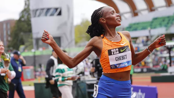 Beatrice Chebet of Kenya, celebrates after setting a world record in the 10,000 with a time of 28:54.14, during the Prefontaine Classic track and field meet Saturday, May 25, 2024, in Eugene, Ore. (AP Photo/Thomas Boyd)