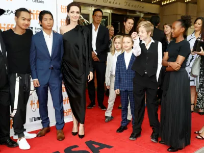 ﻿FILE PHOTO: Director Angelina Jolie arrives on the red carpet with her six children (L-R) Maddox Jolie-Pitt, Pax Jolie-Pitt, Vivienne Jolie-Pitt, Knox Leon Jolie-Pitt, Shiloh Jolie-Pitt, and Zahara Jolie-Pitt for the film "First They Killed My Father" at the Toronto International Film Festival (TIFF), in Toronto, Ontario, Canada, September 11, 2017.  REUTERS/Mark Blinch/File Photo